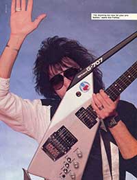 KISS Guitarist Ace Frehley holds a Roland G-707 Guitar Synthesizer Controller